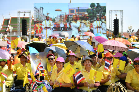 People wait for a coronation procession for Thailand's newly crowned King Maha Vajiralongkorn in Bangkok, Thailand May 5, 2019. REUTERS/Chalinee Thirasupa