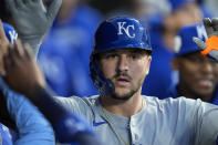Kansas City Royals' Vinnie Pasquantino celebrates in the dugout after hitting a home run during the fourth inning of a baseball game against the Chicago White Sox, Monday, April 15, 2024, in Chicago. (AP Photo/Erin Hooley)