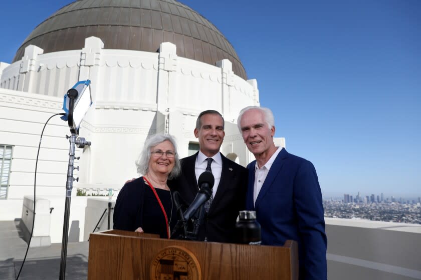 LOS ANGELES, CA - APRIL 19: Los Angeles Mayor Eric Garcetti, center, shown with his father Gil Garcetti, former Los Angeles County's 40th district attorney, and mother Sukey Garcetti, left, before holding his annual State of the City address from the Griffith Observatory Monday, April 19, 2021 in Los Angeles, CA. (Gary Coronado / Los Angeles Times)