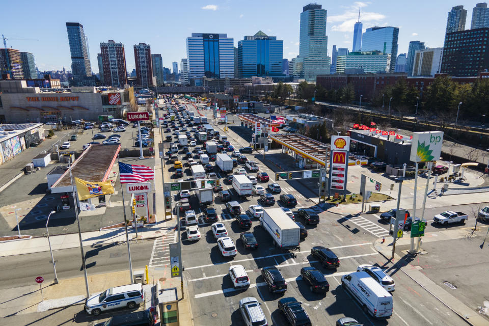 FILE - People wait to drive through the Holland Tunnel into New York City during morning rush hour traffic in Jersey City, New Jersey, on Wednesday, March 8, 2023. New Jersey is incentivizing taxpayers who work from home for New York based employers to sue New York in court for taxing their wages. (AP Photo/Ted Shaffrey, File)