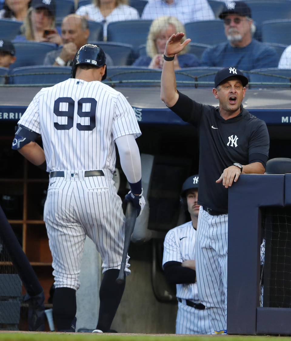 New York Yankees manager Aaron Boone argues with an umpire after New York Yankees' Aaron Judge (99) was called out on strikes during the first inning of the team's baseball game against the Oakland Athletics on Tuesday, June 28, 2022, in New York. (AP Photo/Noah K. Murray)