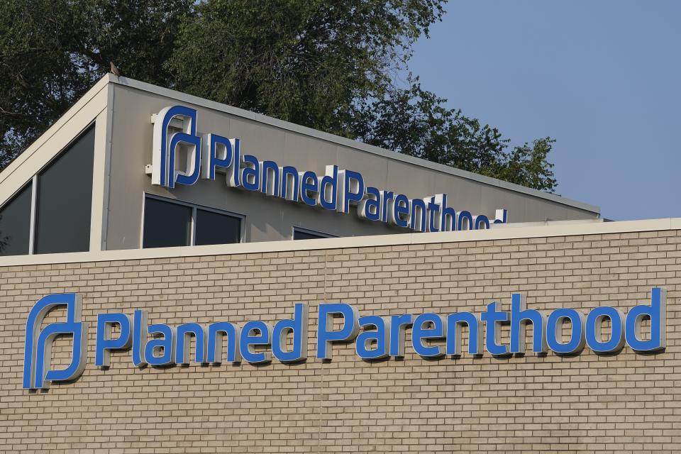 FILE - A Planned Parenthood sign is displayed on the outside of a clinic during a news conference, Tuesday, Aug. 1, 2023, in Indianapolis. Abortion providers are asking an Indiana trial court this week to broaden access to abortions under the state's near-total ban. (AP Photo/Darron Cummings, File)