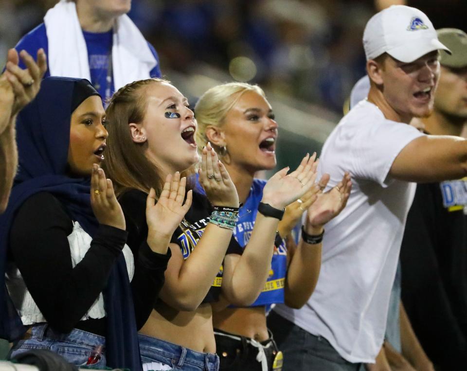 Fans in the endzone student section enjoy the way the game is going in the fourth quarter  of the Blue Hens' 35-9 win at Delaware Stadium, Saturday, Sept. 10, 2022.