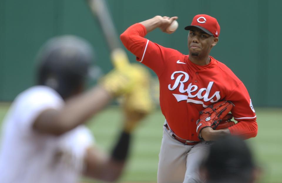 Cincinnati Reds starting pitcher Hunter Greene (21) pitches to Pittsburgh Pirates third baseman Ke'Bryan Hayes (13) during the first inning at PNC Park on May 15, 2022.