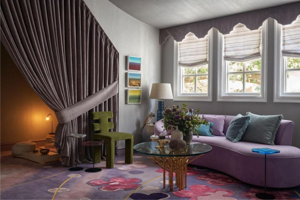 a living room with a purple couch