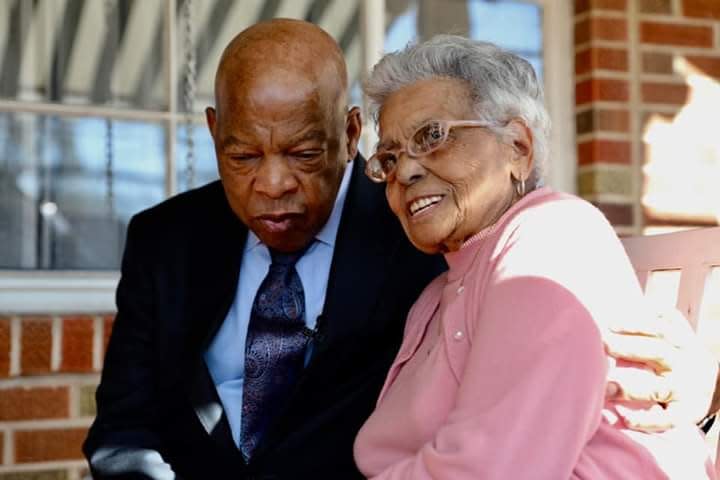 U.S. Rep. John Lewis hugs Vera Harris at her home in Montgomery, Ala., in 2018.