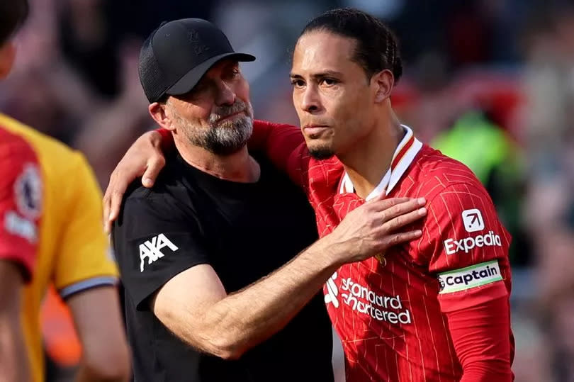 Jürgen Klopp and Virgil van Dijk embrace following the former's final game as Liverpool manager