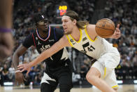 Utah Jazz forward Kelly Olynyk (41) drives to the basket as Los Angeles Clippers guard Reggie Jackson (1) defends during the first half of an NBA basketball game Wednesday, Nov. 30, 2022, in Salt Lake City. (AP Photo/Rick Bowmer)