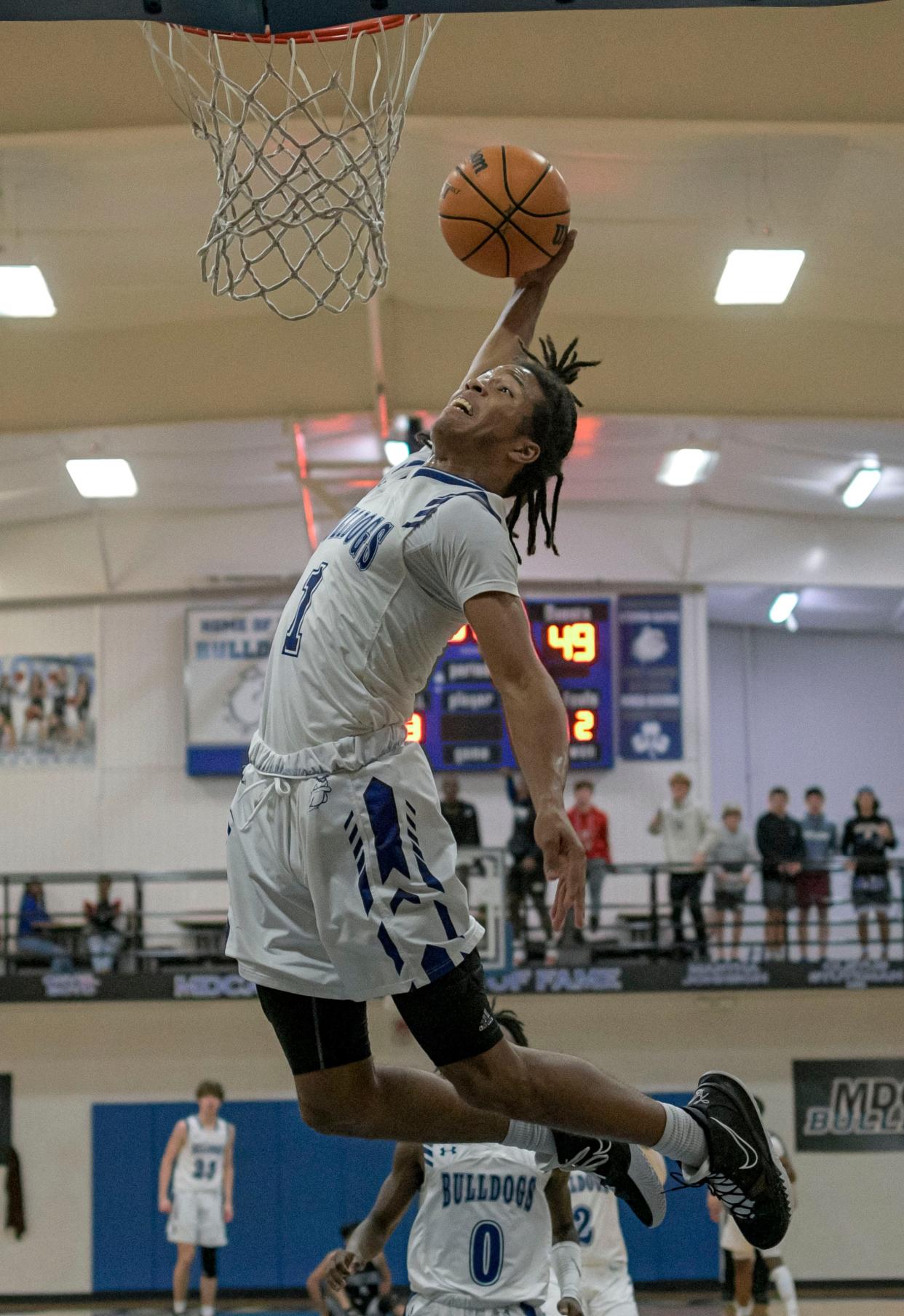 Mount Dora Christian Academy senior Reggie Virgil dunks in the fourth quarter of Friday's game against South Lake ay MDCA's Brackett Gymnasium in Mount Dora.