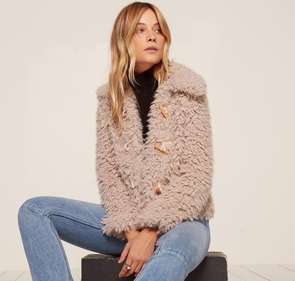 Teddy coats are a particular style of <a href="https://www.huffingtonpost.com/entry/faux-fur-coats-that-look-real_us_5a1da9d9e4b079c1128a42f3" target="_blank">faux fur coat</a> that we predict you'll see everywhere in 2018. Think of them as coats made with teddy bear fur. They've got the warmth, style and texture of faux fur, but with an extra kick of coziness.&nbsp;<br /><br />Pictured: <a href="https://www.thereformation.com/products/teddy-coat-sand" target="_blank">Teddy Coat from Reformation</a>