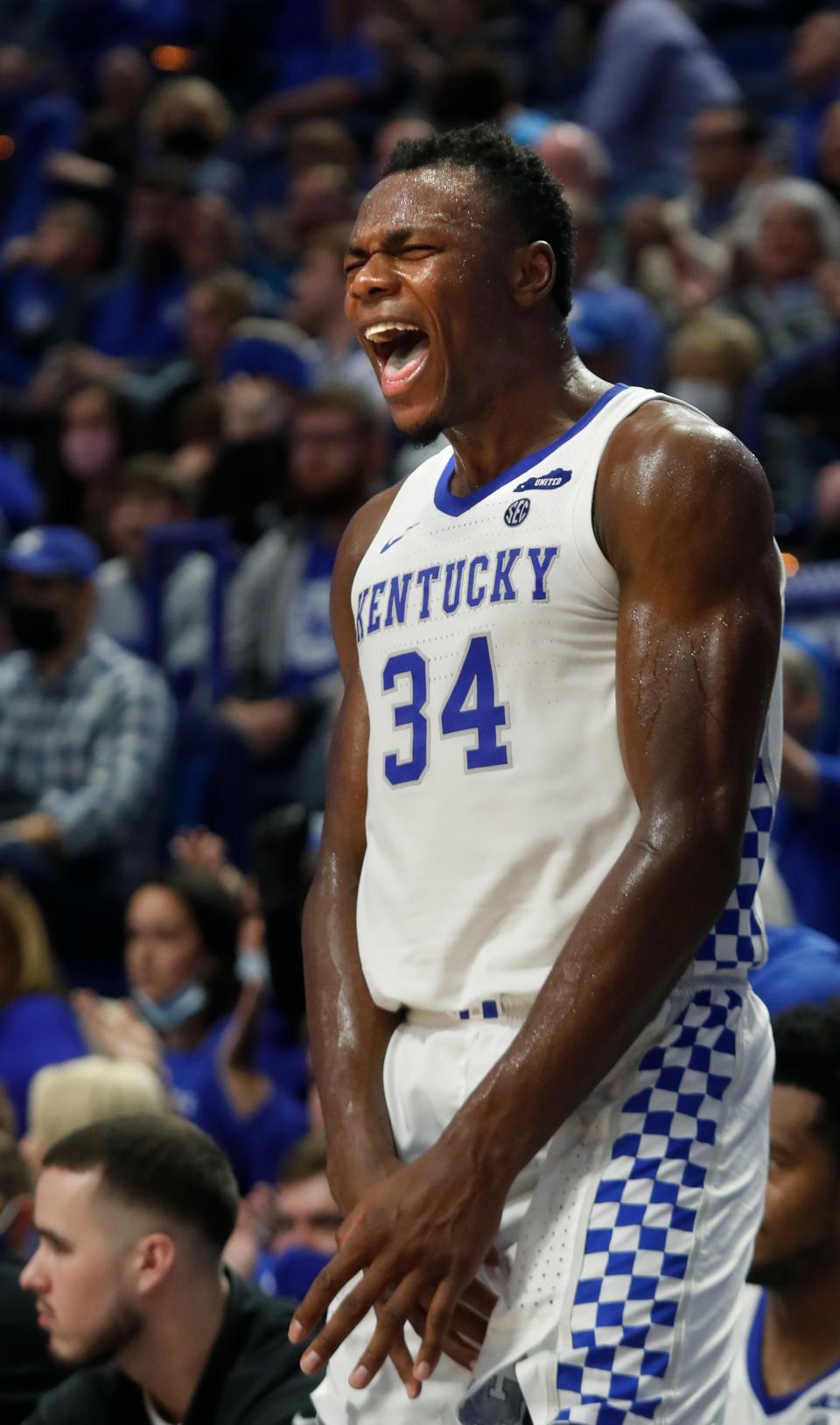 Kentucky’s Oscar Tshiebwe celebrates a teammate making a bucket against Missouri.Dec. 29. 2021