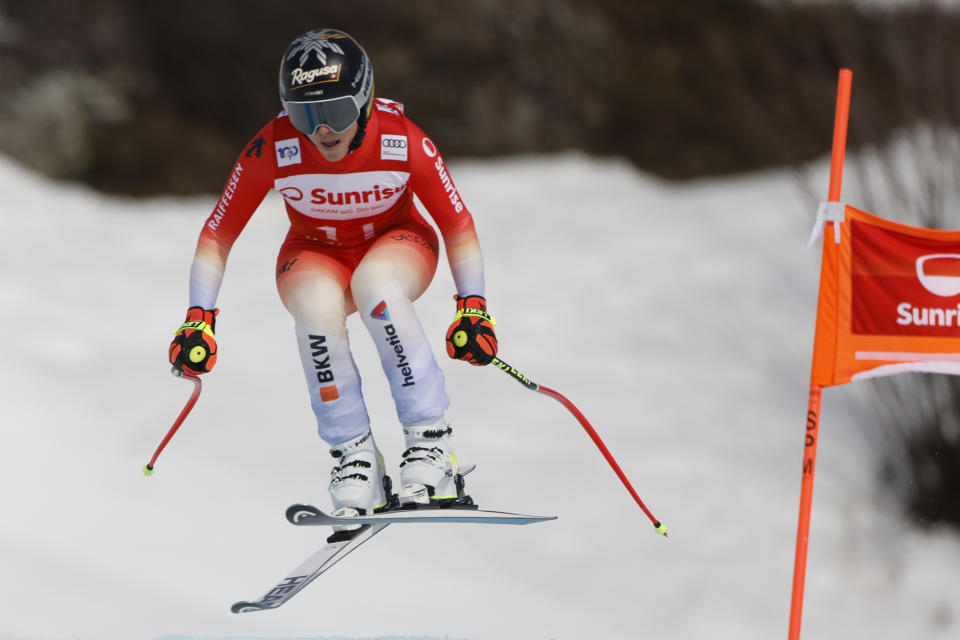 Switzerland's Lara Gut Behrami speeds down the course during an alpine ski, women's World Cup downhill race, in Crans Montana, Switzerland, Friday, Feb. 16, 2024. (AP Photo/Giovanni Pizzato)