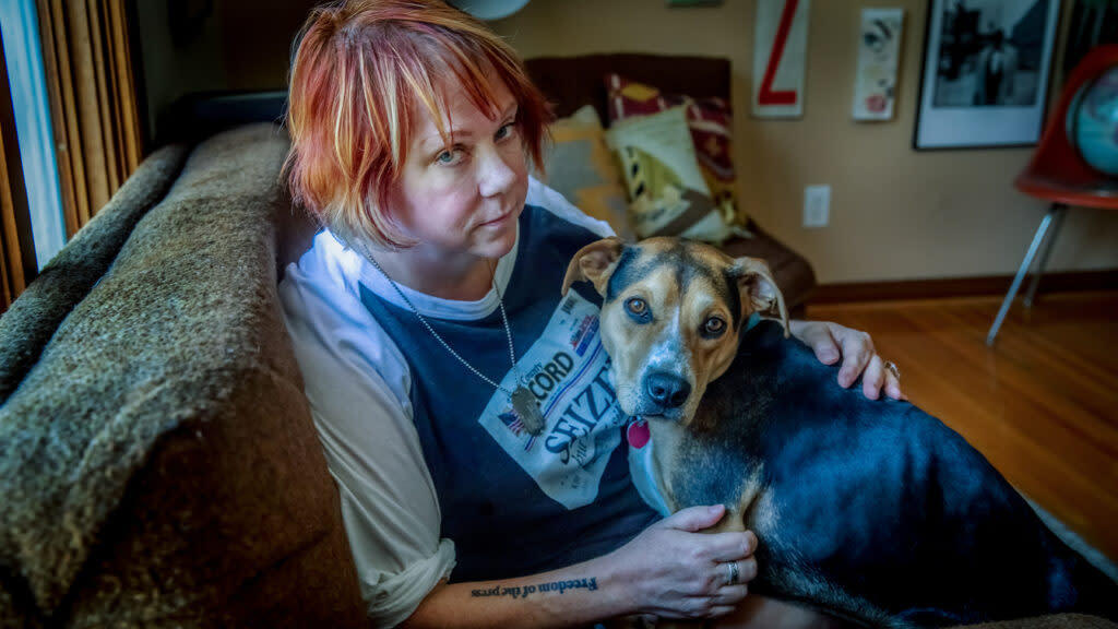 Deb Gruver, with her dog Carmy, says she plans to use part of her $235,000 settlement with former police chief Gideon Cody to start a journalism scholarship for students who "overcome extraordinary challenges in their life."