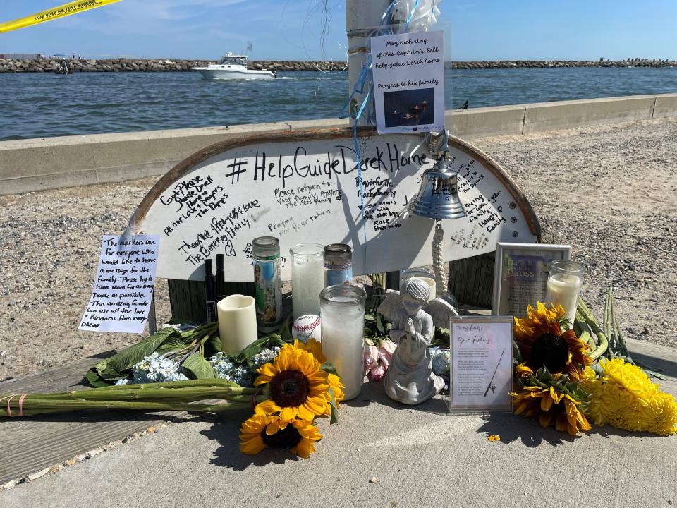 People have left messages, prayers, candles, flowers at the Point Pleasant Beach side of the Manasquan Inlet for Derek Narby, who has been missing since his boat capsized in the inlet last Thursday.