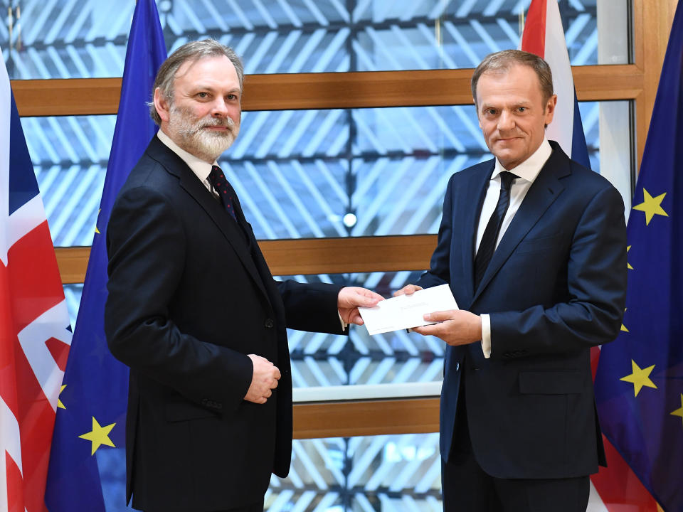 British ambassador to the EU, Sir Tim Barrow delivers the official notice under Article 50 of the Lisbon Treaty to European Council President Donald Tusk in Brussels, Belgium: EPA