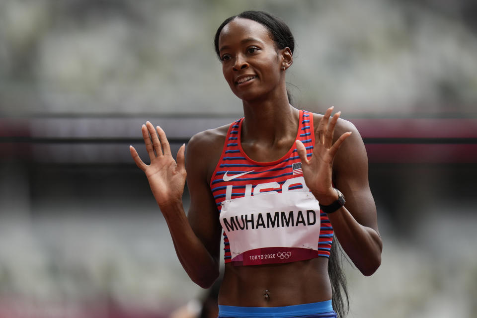 Dalilah Muhammad, of United States, reacts after winning a heat in the women's 400-meter hurdles at the 2020 Summer Olympics, Saturday, July 31, 2021, in Tokyo. (AP Photo/Petr David Josek)