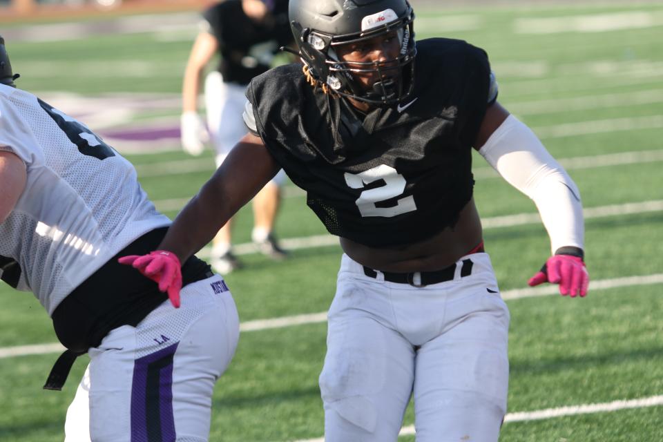 Lipscomb Academy linebacker Kris Thompson throws a block and prepares to make a tackle during an intrasquad scrimmage at the Lipscomb Academy Showcase Thursday, May 9, 2024 in Nashville, Tennessee.