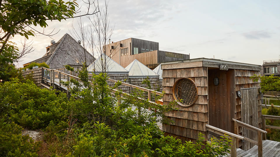 The home looks onto miles of sand dunes, beachfront and protected shoreline.