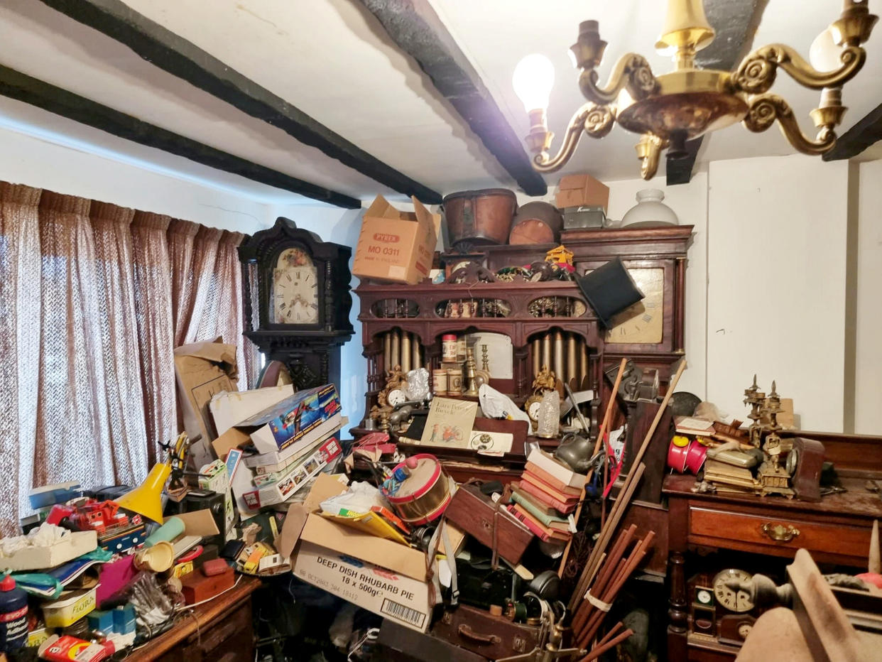 The house in Wolverhampton was piled high with hundreds of antique treasures worth tens of thousands of pounds. (SWNS)