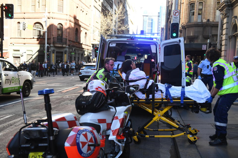 A women is taken by ambulance from Hotel CBD at the corner of King and York Street in Sydney, Tuesday, August 13, 2019. Source: AAP Image/Dean Lewins