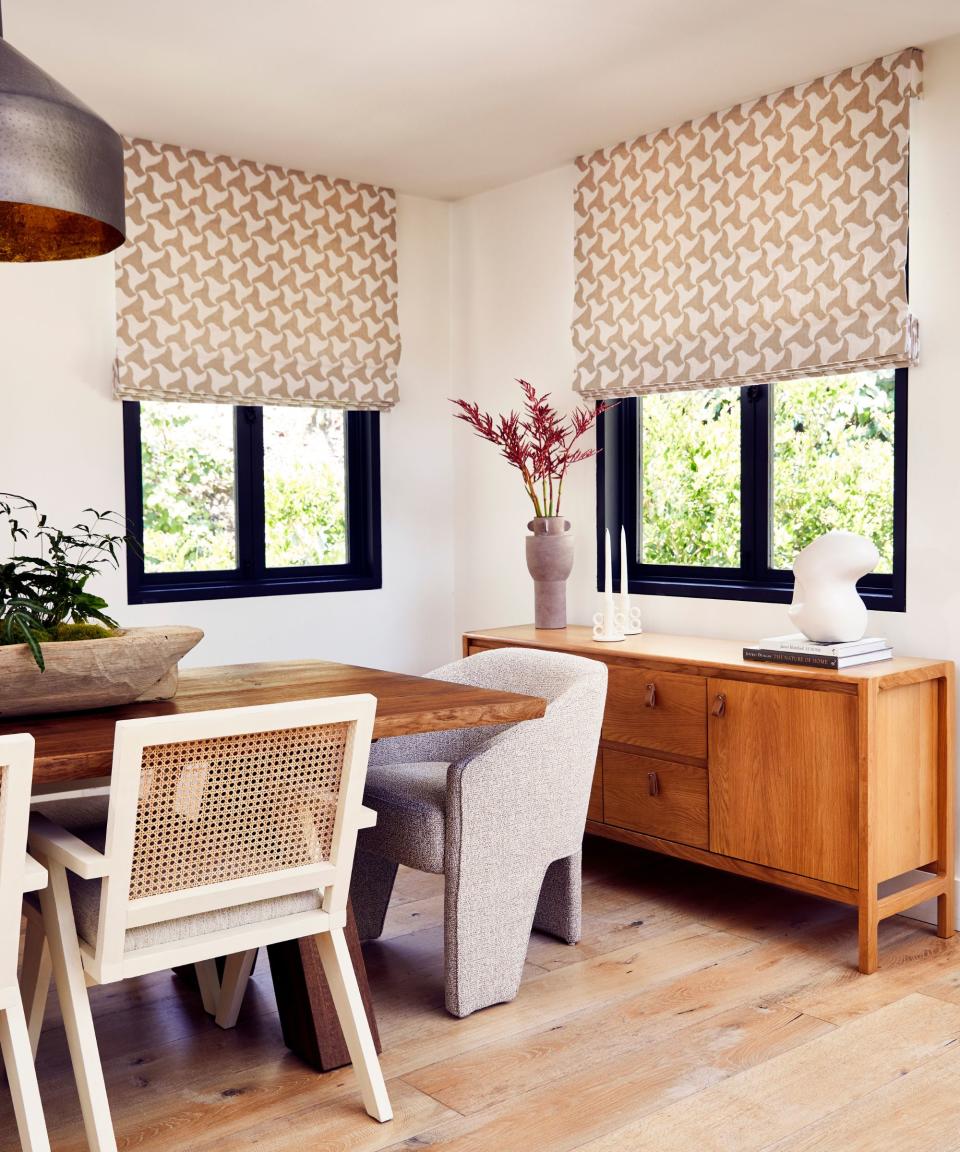 dining room with wood table wood floor and pale wood credenza