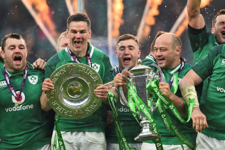 Undefeated: Rory Best and Jonathan Sexton with the trophies at Twickenham