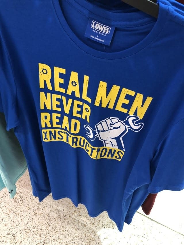 A shirt that says, "Real men never read instructions"