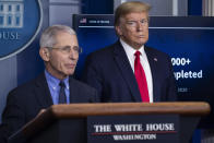 FILE - In this April 17, 2020, file photo Dr. Anthony Fauci, director of the National Institute of Allergy and Infectious Diseases, speaks about the coronavirus, as President Donald Trump listens, in the James Brady Press Briefing Room of the White House in Washington. (AP Photo/Alex Brandon, File)