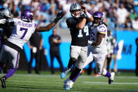 Carolina Panthers quarterback Sam Darnold (14) runs out of the pocket against the Minnesota Vikings during the second half of an NFL football game, Sunday, Oct. 17, 2021, in Charlotte, N.C. (AP Photo/Jacob Kupferman)