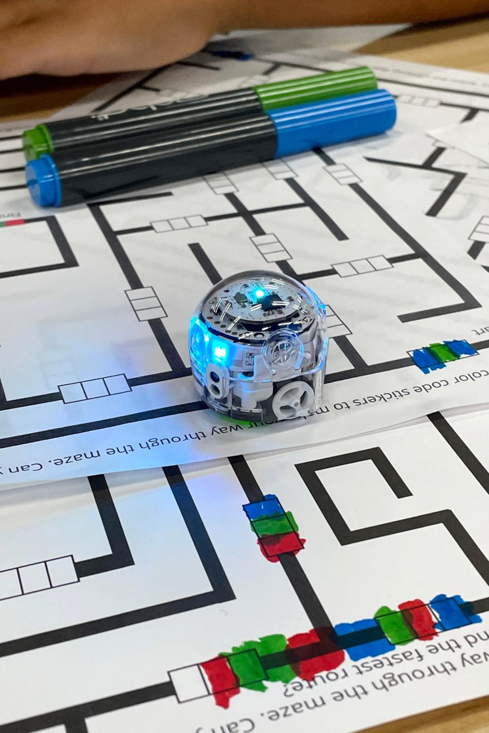 The Ozobot robot teaches basic programming techniques by allowing users to control its movements using colored markers to create Òcommands.Ó