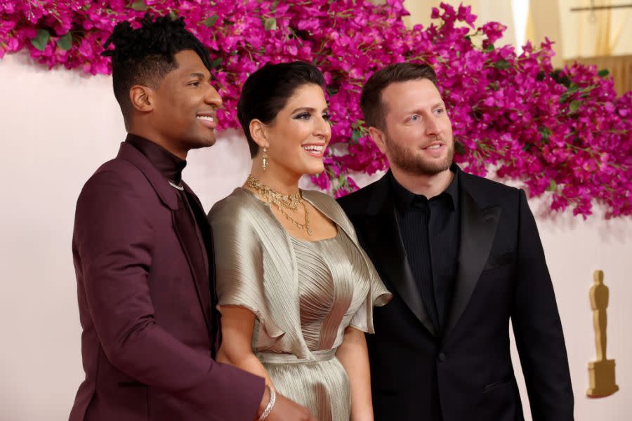 HOLLYWOOD, CALIFORNIA – MARCH 10: (L-R) Jon Batiste, Suleika Jaouad, and Mathew Heineman attend the 96th Annual Academy Awards on March 10, 2024 in Hollywood, California. (Photo by Mike Coppola/Getty Images)