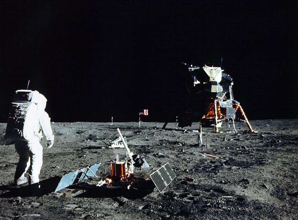 JULY 1969 FILE PHOTO - Astronaut Edwin E. Aldrin Jr., lunar module pilot, is photographed during the Apollo 11 extravehicular activity on the Moon in this July, 1969 file photo. He had just deployed the Early Apollo Scientific Experiments Package (EASEP). In the foreground is the Passive Seismic Experiment Package (PSEP); beyond it is the Laser Ranging RetroReflector (LR-3); in the center background is the United States flag; in the left background is the black and white lunar surface television camera; in the far right background is the Lunar Module. Astronaut Neil A. Armstrong took this photograph with a 70mm lunar surface camera. July 16 marks the 30th anniversary of the Apollo 11 launch.    SV/JP