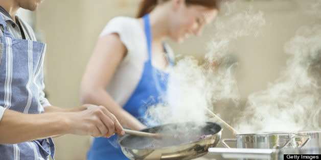 Couple cooking in kitchen