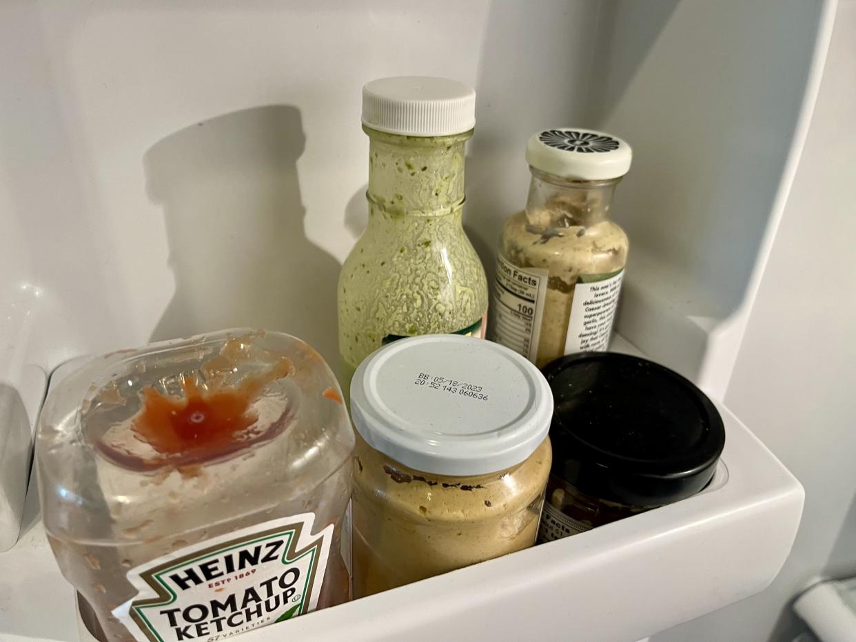 condiment bottles in a fridge