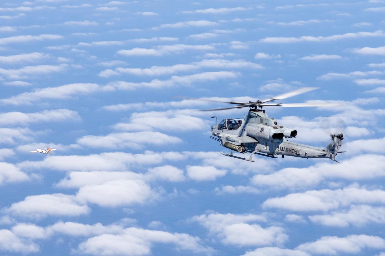 A U.S. Marine Corps AH-1Z with Marine Medium Tiltrotor Squadron (VMM) 362 (Reinforced), 13th Marine Expeditionary Unit, conducts flight operations over the Pacific Ocean, Aug. 8, 2022.