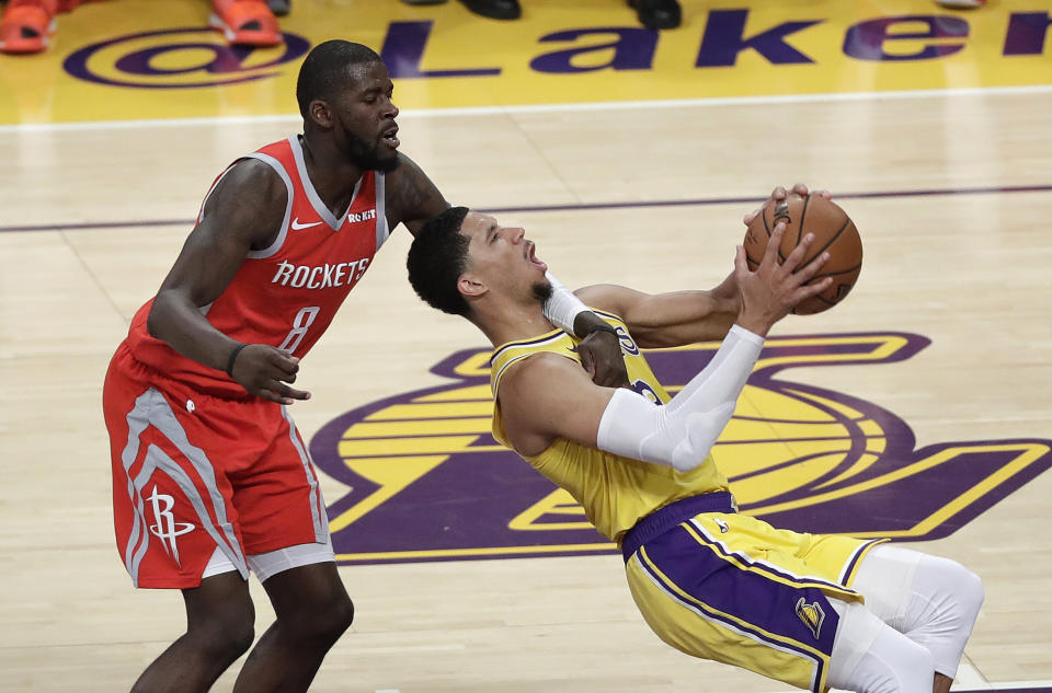 Los Angeles Lakers' Josh Hart, right, is fouled by Houston Rockets' James Ennis III (8) as Hart drives to the basket during the second half of an NBA basketball game Saturday, Oct. 20, 2018, in Los Angeles. (AP Photo/Marcio Jose Sanchez)