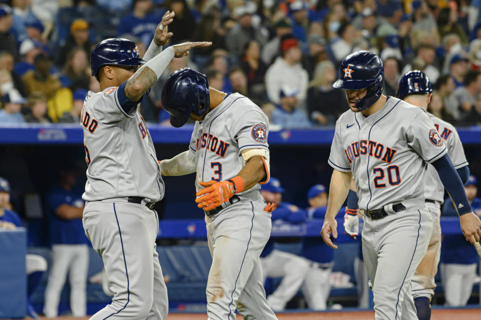 Houston Astros' Jeremy Pena (3) celebrates with teammates after hitting a home run against the Toronto Blue Jays during the sixth inning of a baseball game Friday, April 29, 2022, in Toronto. (Christopher Katsarov/The Canadian Press via AP)