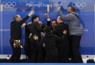 Ice Hockey - Pyeongchang 2018 Winter Olympics - Men's Quarterfinal Match - Sweden v Germany - Kwandong Hockey Centre, Gangneung, South Korea - February 21, 2018 - German coaches celebrate after the match. REUTERS/Kim Kyung-Hoon