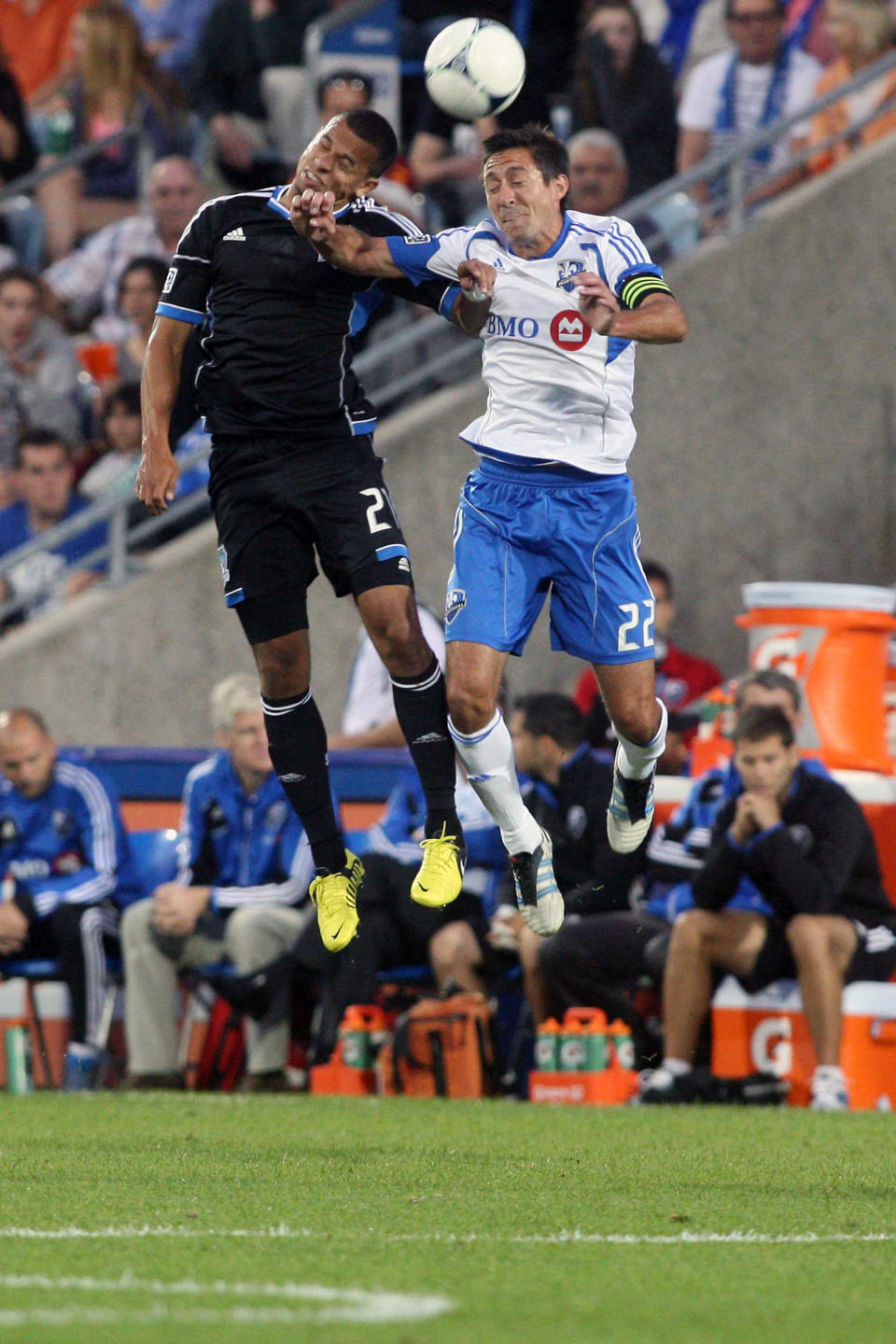 MONTREAL, CANADA - AUGUST 18: Jason Hernandez #21 of the San Jose Earthquakes and Davy Arnaud #22 of the Montreal Impact jump to head the ball during the match at the Saputo Stadium on August 18, 2012 in Montreal, Quebec, Canada. (Photo by Richard Wolowicz/Getty Images)