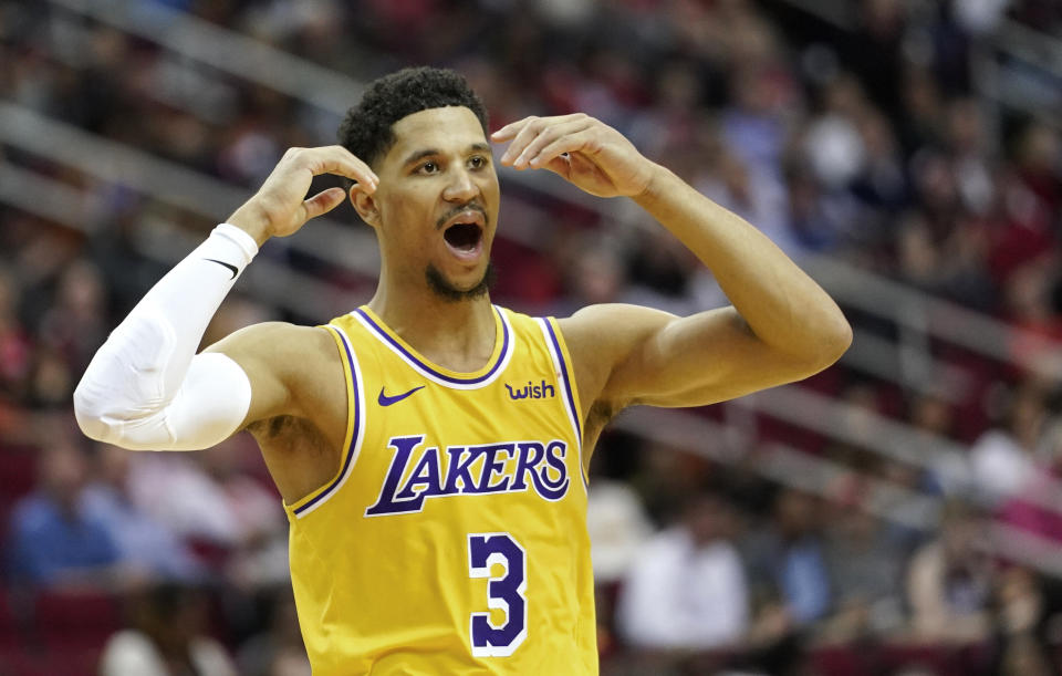 Los Angeles Lakers' Josh Hart reacts after fouling Houston Rockets' James Harden during the second half of an NBA basketball game Thursday, Dec. 13, 2018, in Houston. The Rockets won 126-111. (AP Photo/David J. Phillip)