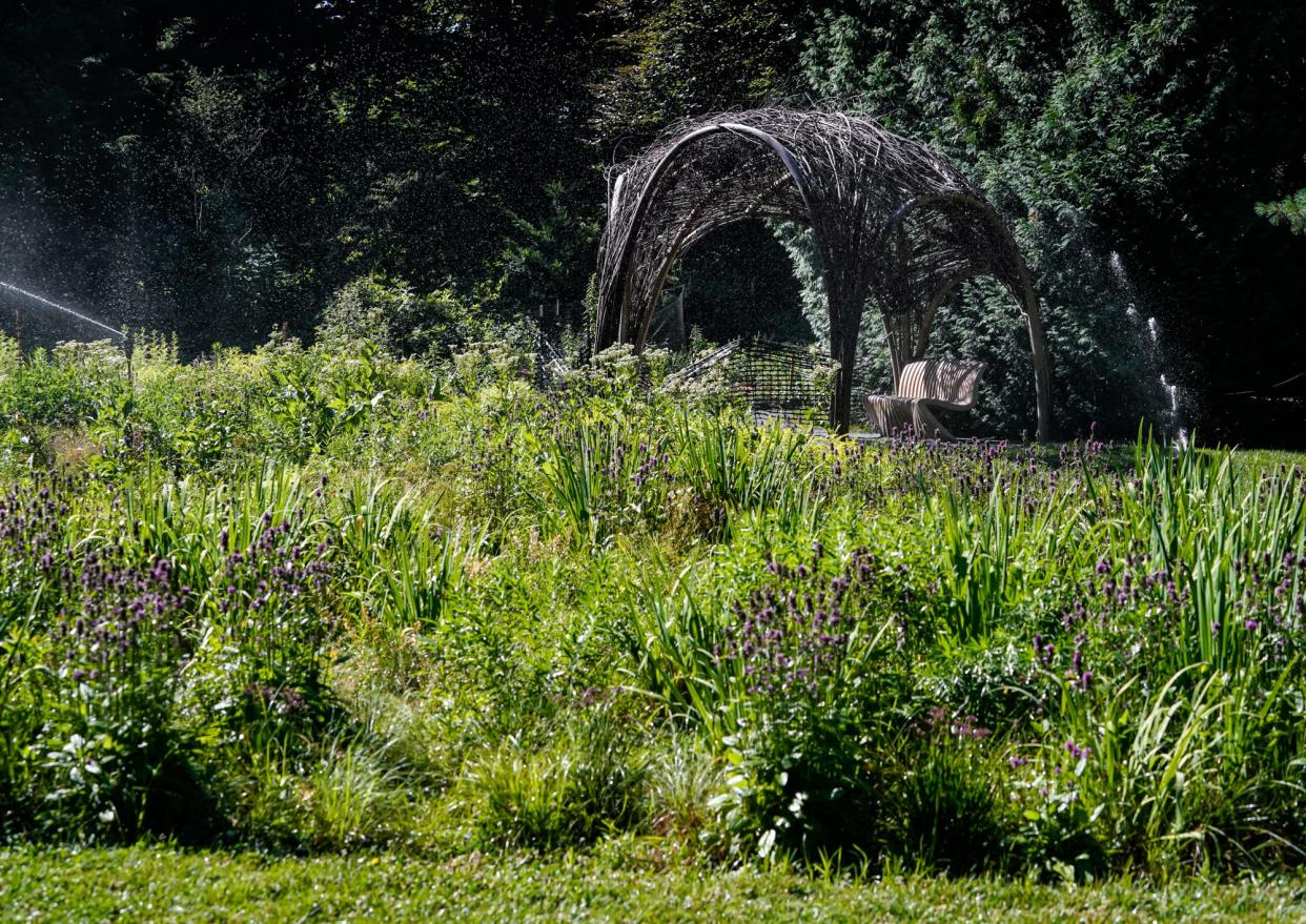 A pollinator meadow in the orchard with work by Corey Robinson connects with the Lume Indianapolis, Featuring Monet & Friends Alive, on Thursday, June 30, 2022, at the Indianapolis Museum of Art in Indianapolis. 