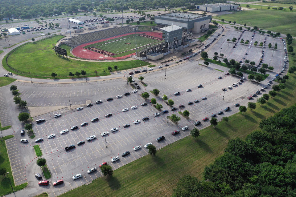 An aerial view from a drone as residents wait in line for the drive-thru COVID-19 testing center at the Ellis Davis Field House on July 2 in Dallas | Tom Pennington—Getty Images