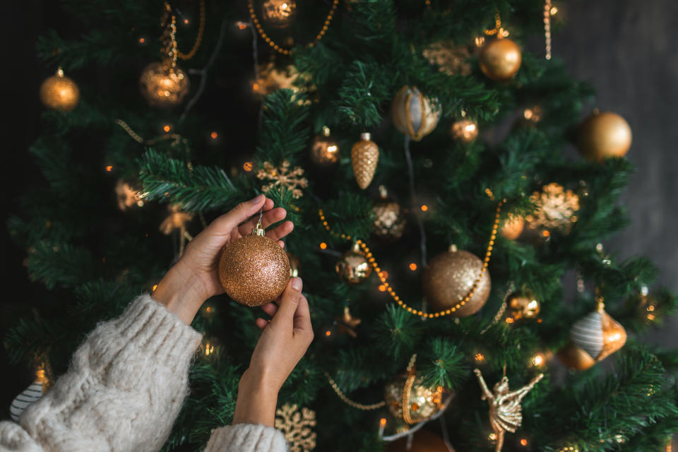 For an unlucky few, decorating or touching a Christmas tree can pose a real health risk. (Photo via Getty Images)