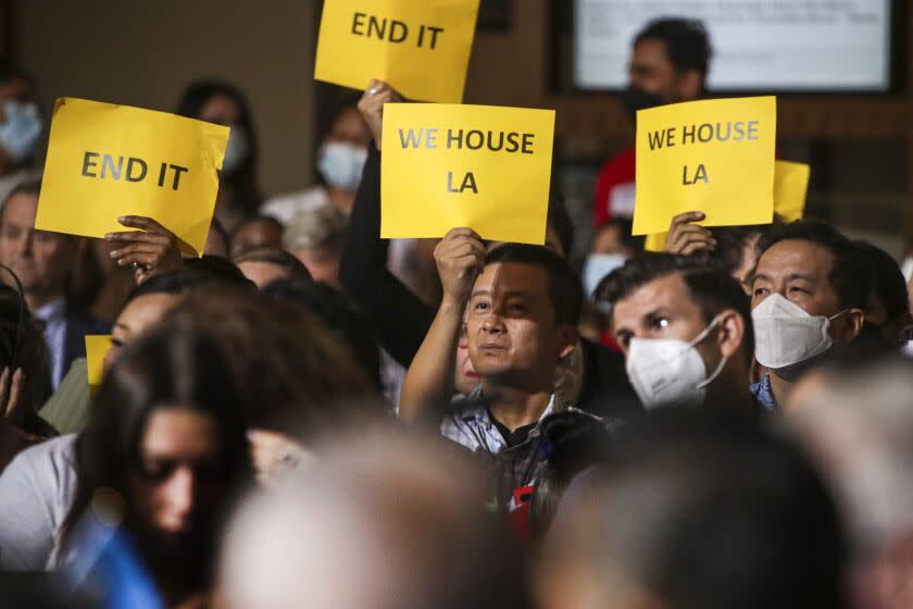 Los Angeles, CA - October 04: The Los Angeles City Council has voted to end long-standing renter eviction protections due to COVID-19 hardship on Jan. 31, 2023. Landlords will be able to resume increasing rent on rent-controlled apartments, which account for three-quarters of apartments in Los Angeles, beginning in February 2024. Landlords raise their signs in support of the end of eviction moratorium vote City Hall on Tuesday, Oct. 4, 2022 in Los Angeles, CA. (Irfan Khan / Los Angeles Times)