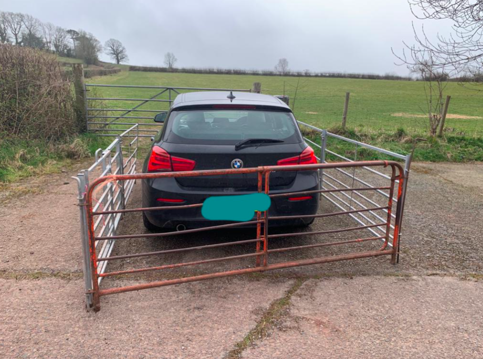 The farmer constructed a metal fence around the BMW after it blocked access to the field. (Wales News)