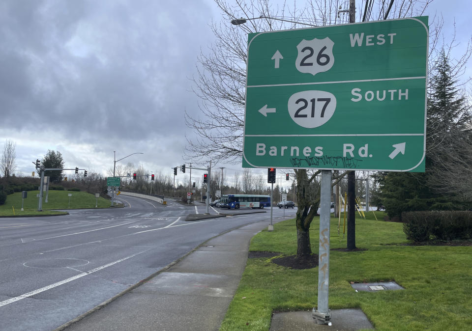 Road signs show the intersection of Barnes Road and Oregon Route 217 in Cedar Hills neighborhood of southwest Portland, Ore., just next to the suburb of Beaverton, Sunday, Jan. 7, 2024. The National Transportation Safety Board estimated that part of the fuselage of a Boeing 737 Max 9 that detached shortly after the takeoff of an Alaska Airlines flight on Friday, Jan. 5, may have fallen near the intersection. (AP Photo/Claire Rush)