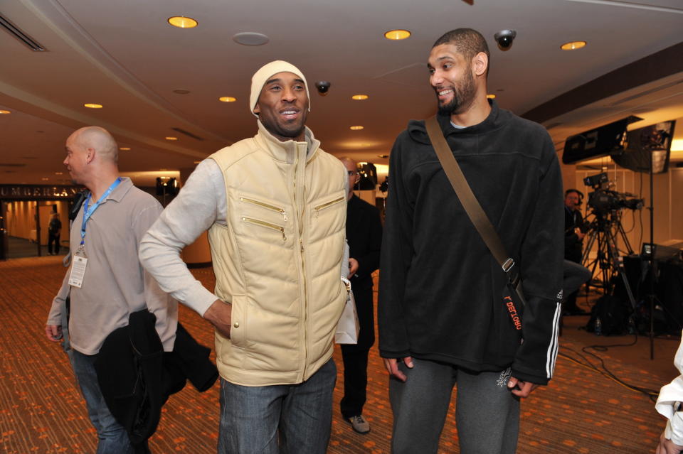 Kobe Bryant and Tim Duncan share a laugh at 2010 All-Star Weekend. (Photo by Jesse D. Garrabrant/NBAE via Getty Images)