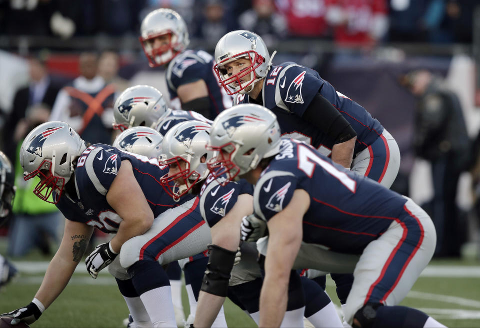 Quarterback Tom Brady had a lesson for his new center. (AP Photo/Charles Krupa)