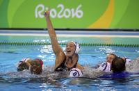 <p>Team USA’s members jump into the pool to celebrate their victory over Italy. (Reuters) </p>