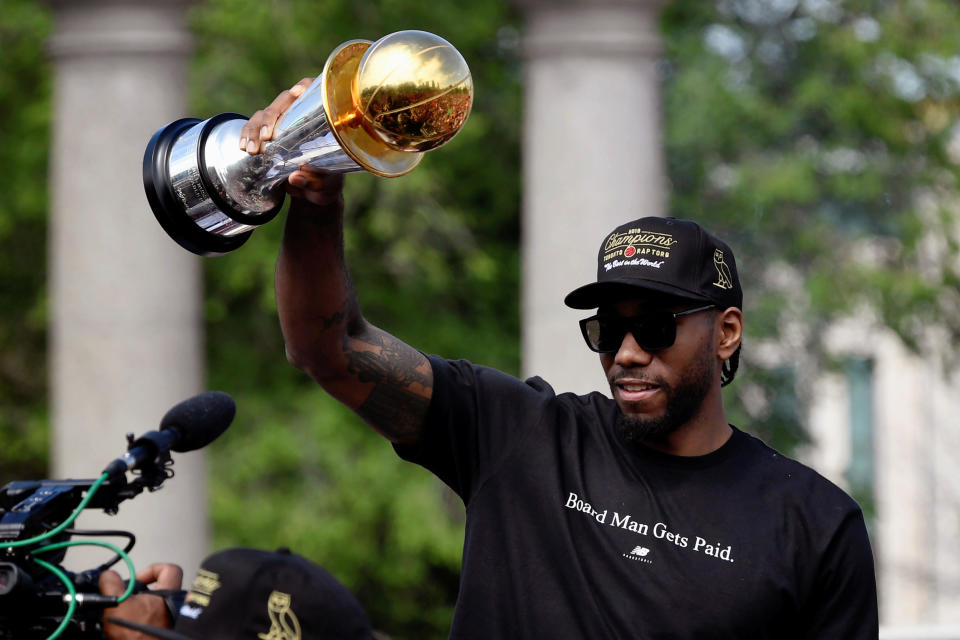 Toronto Raptors basketball player Kawhi Leonard hold his MVP trophy during the Raptors victory parade after defeating the Golden State Warriors in the 2019 NBA Finals, in Toronto, Ontario, Canada June 17, 2019.    REUTERS/Moe Doiron